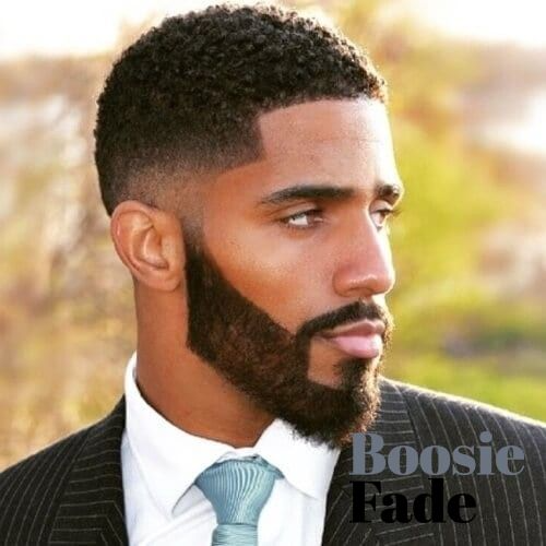 boosie fade hair with a suit on